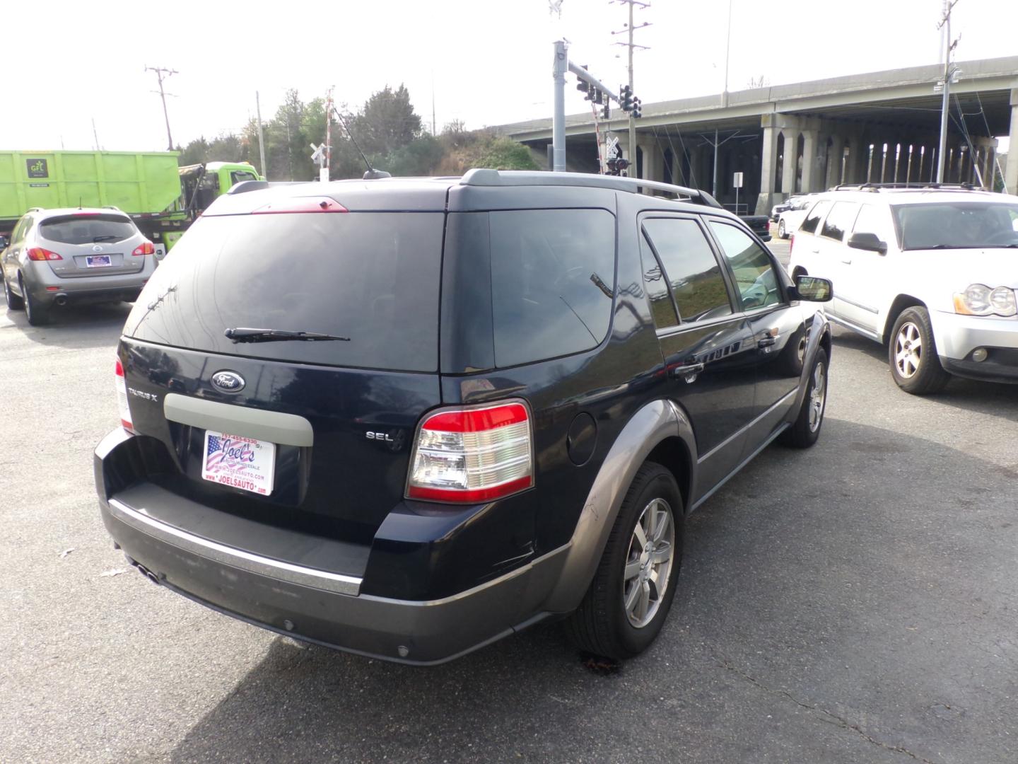 2008 Blue Ford Taurus X SEL FWD (1FMDK02W18G) with an 3.5L V6 DOHC 24V engine, 6-Speed Automatic Overdrive transmission, located at 5700 Curlew Drive, Norfolk, VA, 23502, (757) 455-6330, 36.841885, -76.209412 - Photo#14